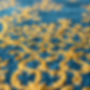 Close-up of intricate patterns on a blue and gold area rug
