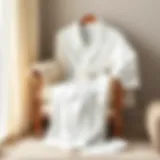 Elegant white bathrobe draped over a plush chair