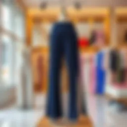 Elegant flowy pants with intricate side slits showcased on a mannequin in a chic boutique.