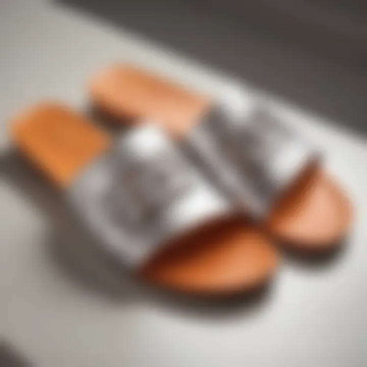 A close-up of premium materials used in Hermes slide sandals