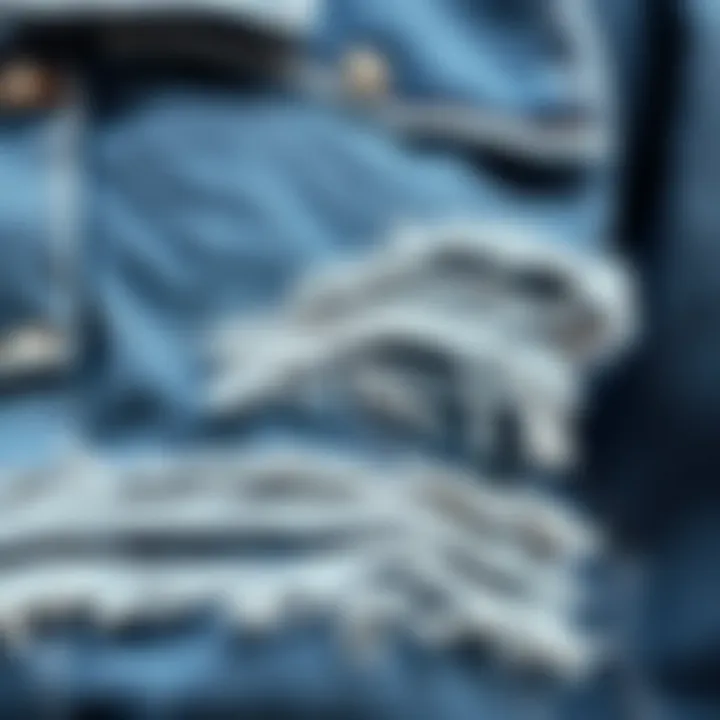 Close-up of fabric textures on a ripped jean jacket