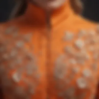 Close-up of intricate fabric details showcasing the craftsmanship of an orange modest dress