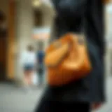 Stylish camel color crossbody bag on a modern outfit